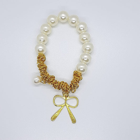 bracciale elastico fiocco dorato perla